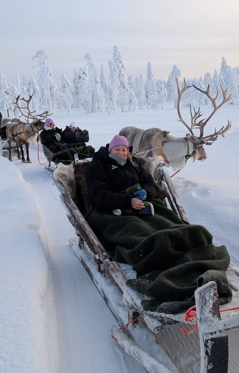 Jillian tucked up a reindeer-drawn sled Jillian tucked up a reindeer-drawn sled