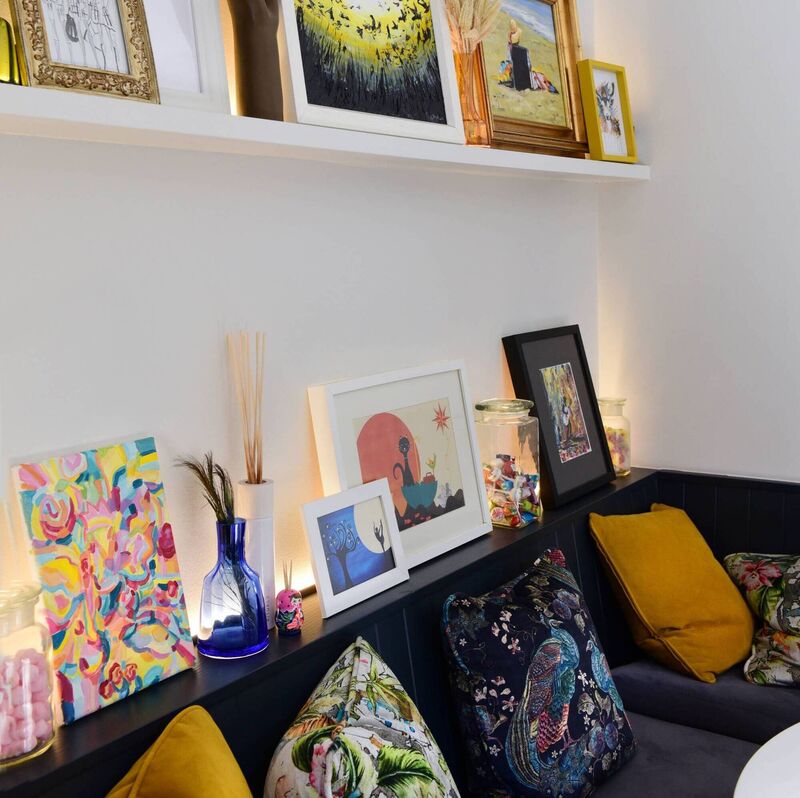 Shelf uplighting provides accent lighting over the dining table in Jen Sheahan 's home in Rathmines. Picture: Moya Nolan