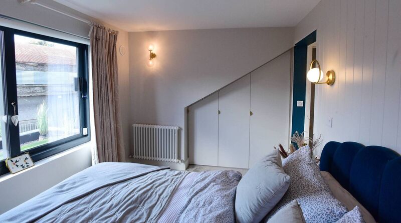 Hang curtains higher and wider than your windows and make them floor length: the bedroom of Home of the Year 2021 winner Jen Sheahan's home in Rathmines. Picture: Moya Nolan