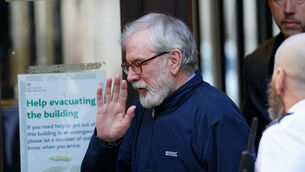<p>Gerry Adams is defending the legal action against him at the Royal Courts of Justice in London (Ben Whitley/PA)</p>