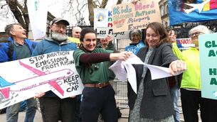 <p> Campaigners from Children’s Rights over Flights and Irish Doctors for the Environment outside the Dáil yesterday where they tore up a copy of a proposed bill that would allow the transport minister to abolish the Dublin Airport passenger cap. Picture: Leah Farrell/RollingNews</p>