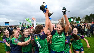 <p>St John Bosco Community College players including Naoise Talty, 9, and Emma Kelly celebrate with the cup following the Lidl Post Primary Schools All-Ireland Junior ‘C’ final match between Salerno Secondary School, Galway, and St John Bosco Community College, Kildysart, Clare, at St Brigid’s GAA Club in Kiltoom, Roscommon. Photo by Stephen McCarthy/Sportsfile</p>