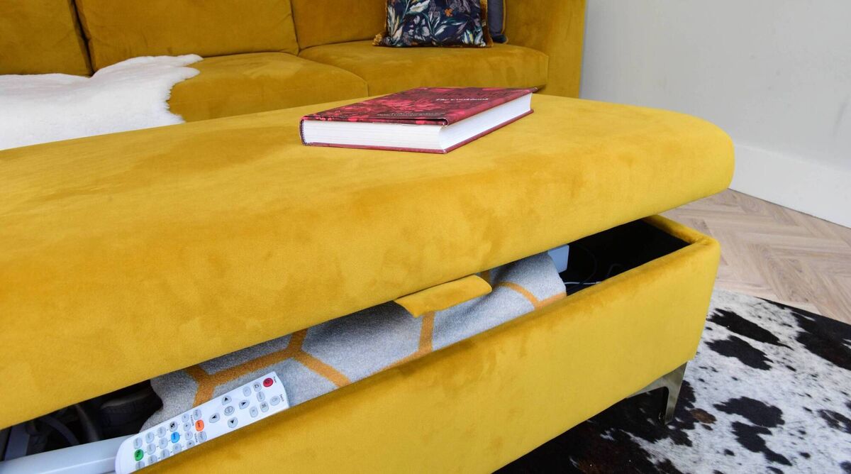 At Jen Sheahan's home in Rathmines a couch with a matching storage ottoman is more versatile than an L-shaped couch. Picture: Moya Nolan At Jen Sheahan's home in Rathmines a couch with a matching storage ottoman is more versatile than an L-shaped couch. Picture: Moya Nolan