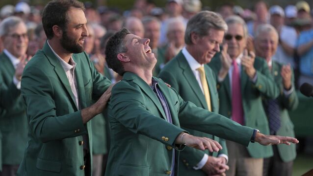 <p>DINNER'S READY: Scottie Scheffler puts the green Jacket on Rory McIlroy. Pic: AP Photo/Matt Slocum.</p>