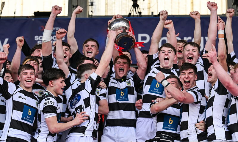 Rian MacFarlane O'Shea of Presentation Brothers College lifts the cup with his teammates. Pic: Paul Phelan/Sportsfile