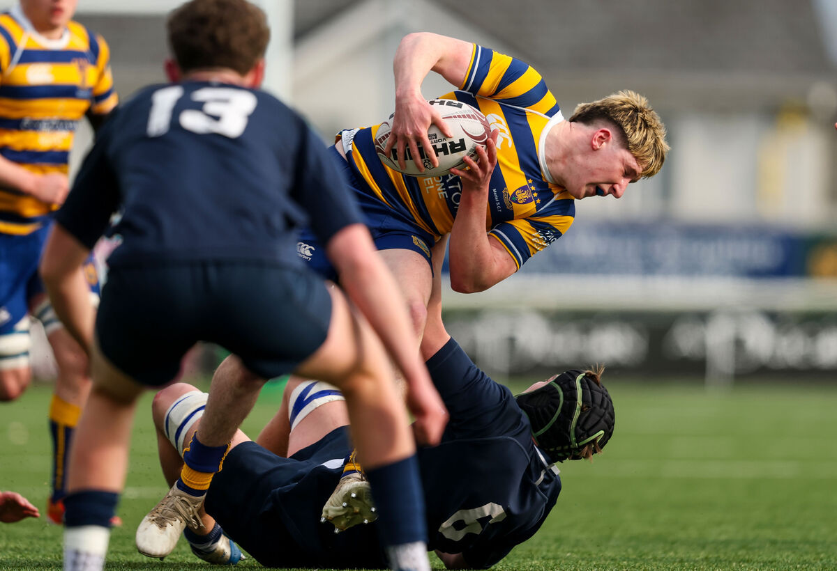 Sligo Grammar’s Aron Martin tackles Owen Egan of Marist College. Pic: Nick Elliott/Inpho