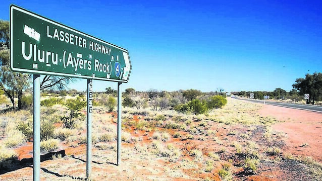 <p>SIGN OF THE TIMES: An iconic road sign directing towards Uluru (Ayers Rock) in the Northern Territory, Australia.</p>