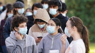 <p>Students wait in line at the entrance to the sports hall at the University of Kent campus in Canterbury, where the rollout of a meningitis B vaccine has begun (Gareth Fuller/PA)</p>