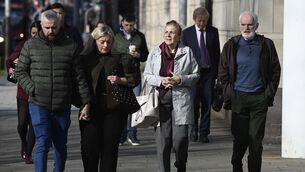 <p>Noel (right) and Bernie McNally (second from right), the parents of Natalie McNally, and her brother Niall (left) arrive at Belfast Crown Court on Thursday Picture: Mark Marlow/PA</p>