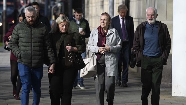 <p>Noel (right) and Bernie McNally (second from right), the parents of Natalie McNally, and her brother Niall (left) arrive at Belfast Crown Court on Thursday Picture: Mark Marlow/PA</p>