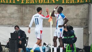 <p>Ismaila Sarr, right, is congratulated after opening the scoring for Palace. Pic: Petros Karadjias/AP</p>