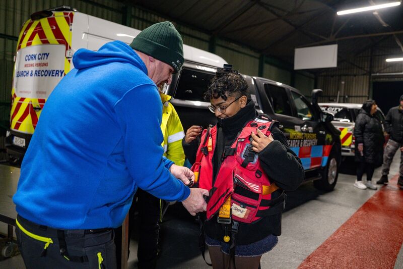 Christy O’Donovan helps ‘Irish Examiner’ reporter Imasha Costa into a lifejacket before heading out on the River Lee with the volunteer team. The group receives no State funding and relies on public support.