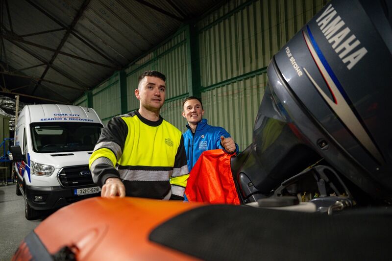 Firefighters by day and volunteers by night, Eoghan Cahill and Ben O’Flynn prepare a search boat at the Cork City Missing Persons Search and Recovery base. Picture: Chani Anderson