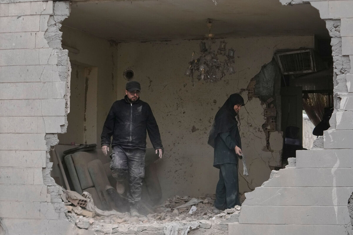 People clean debris from their apartment damaged when a nearby police station was hit Friday in a US-Israeli strike in Tehran, Iran. Picture: AP Photo/Vahid Salemi) People clean debris from their apartment damaged when a nearby police station was hit Friday in a US-Israeli strike in Tehran, Iran. Picture: AP Photo/Vahid Salemi)