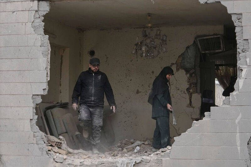People clean debris from their apartment damaged when a nearby police station was hit Friday in a US-Israeli strike in Tehran, Iran. Picture: AP Photo/Vahid Salemi) People clean debris from their apartment damaged when a nearby police station was hit Friday in a US-Israeli strike in Tehran, Iran. Picture: AP Photo/Vahid Salemi)