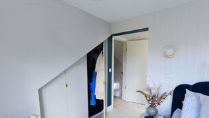 <p>Custom doors hide the Elfa modular wardrobe system under the eaves of Jennifer Sehahan's home. Pictures: Moya Nolan</p>