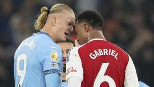 <p>HEAD TO HEAD: Manchester City's Erling Haaland has a disagreement with Arsenal's Gabriel. Pic: AP Photo/Dave Thompson.</p>