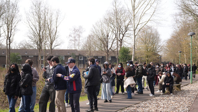 Students queued on Friday to get vaccinations (Gareth Fuller/PA)