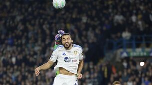 <p>THERE SOMEWHERE: Brentford goalkeeper Caoimhin Kelleher (rear) punches the ball clear from Leeds United's Dominic Calvert-Lewin. Pic: Richard Sellers/PA Wire.</p>