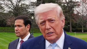 President Donald Trump speaks with reporters before departing on Marine One (Alex Brandon/AP)