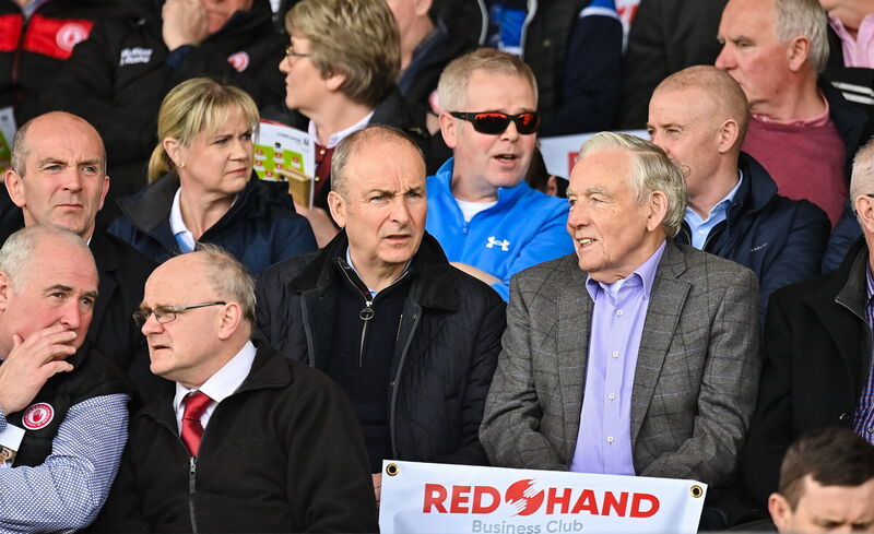 An Taoiseach Micheál Martin TD along with Tyrone sponsor Seamus McAleer during the National Football League Division 2 game at Healy Park in Omagh. Pic: Oliver McVeigh/Sportsfile