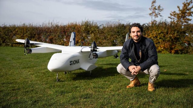 <p>Iona founder Etienne Louvet with one of the company's drones. </p>