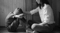 Parent comforting helping sad emotional child at home, concept of bullying, stress disappointment, sadness.