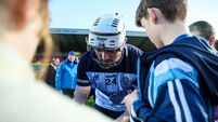 Conor Donohoe signs an autograph for a fan after the game 21/3/2026