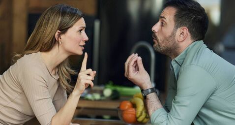 Young couple having an argument at home.