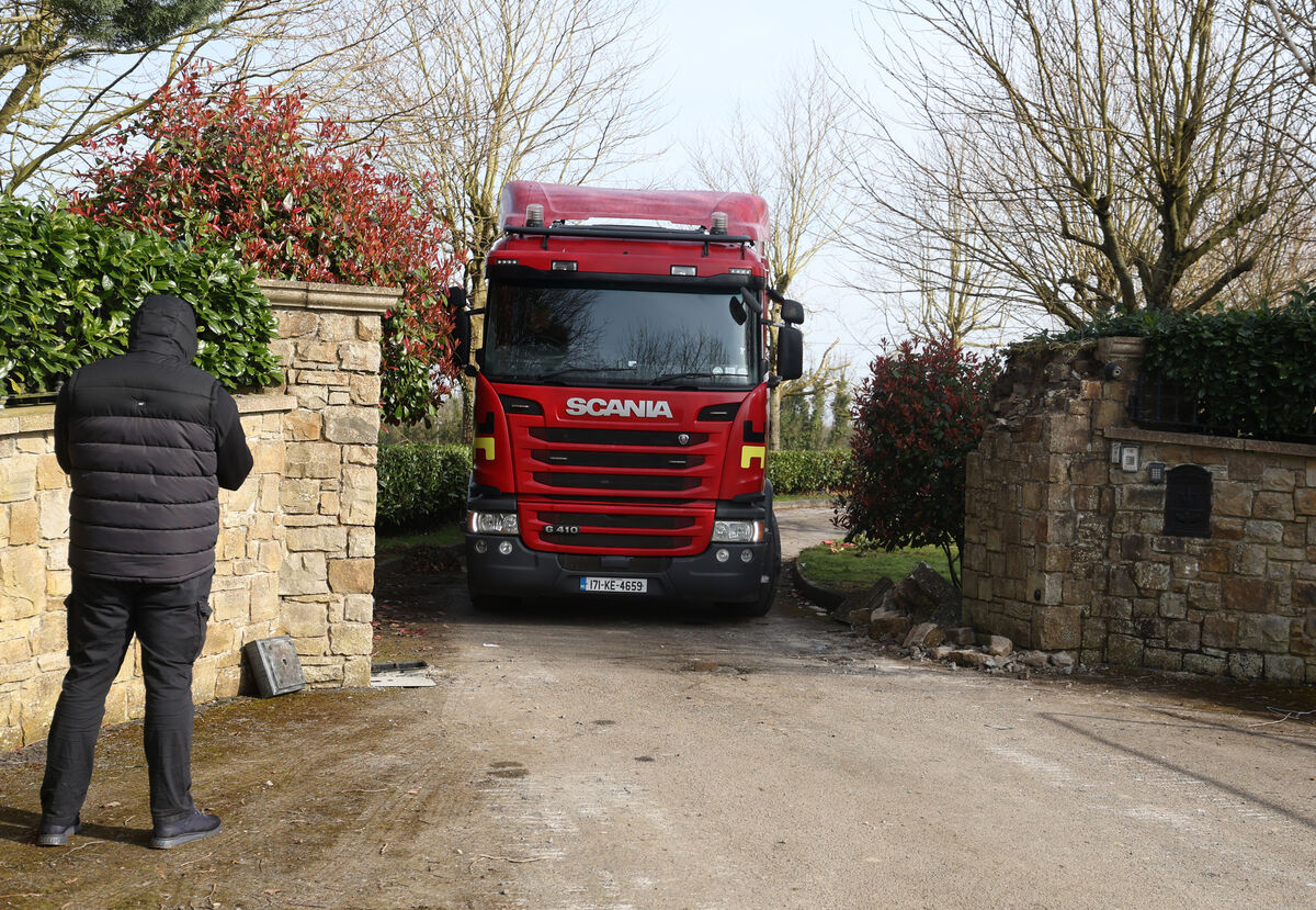 Trucks and workmen at the house in Co Meath on Friday which is at the centre of the 20-year legal battle. Photo: Leah Farrell/© RollingNews.ie