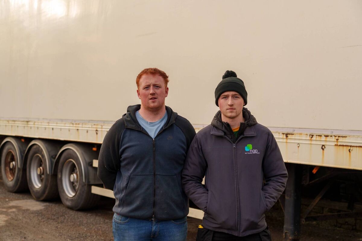 Odhran (left) and Tadhg Murray next to at articulated trailers blocking the entrance to the house in question. Photo: Barry Cronin