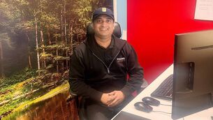 <p>Kiran Kumar behind his desk at work at Phonewatch: 'When I’ve done my last [night] shift, I try to stay up for as long as I can so I get back into the daytime routine. That’s what works for me.'</p>