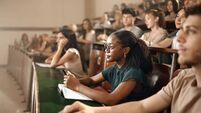 University students attending a class at lecture hall.