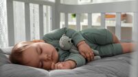 Cute little baby sleeping in crib at home. Bedtime