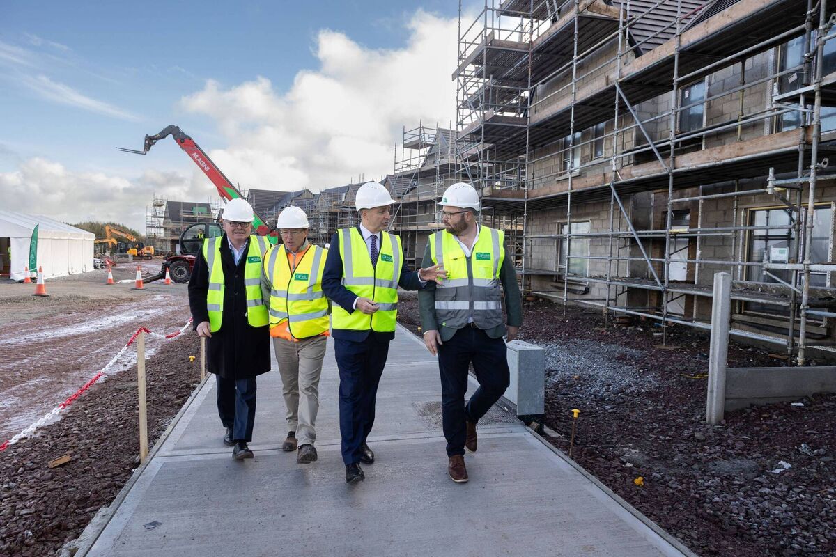 At the Longview Estates housing development in Ballyvolane, Cork: Neil Kerrigan of Enterprise Ireland, John Crean of Longview Estates, An Taoiseach Micheál Martin and Patrick Crowley, CEO of CField Construction. The 700 new homes — a mix of private and social housing — are being made using advanced offsite manufacturing and factory-style on-site processes. Picture: Darragh Kane 