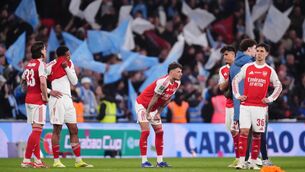 <p>Arsenal's Ben White (centre) appears dejected with team mates after the final whistle during the Carabao Cup Final. Pic: John Walton/PA Wire. </p>