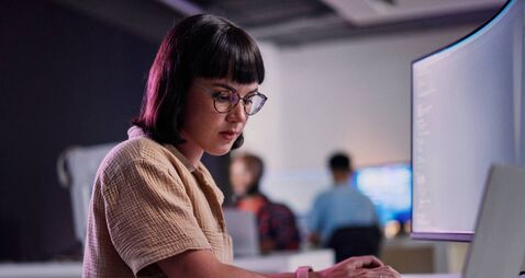 Professional IT worker working late, coding and machine learning working with AI.