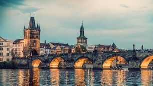 <p>Evening view of the Charles Bridge on the Vltava River in the historic centre of the capital city of Prague.</p>