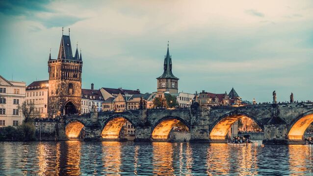 <p>Evening view of the Charles Bridge on the Vltava River in the historic centre of the capital city of Prague.</p>