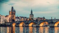 Evening view of the Charles Bridge on the Vltava River in the historic center of the capital city of Prague - Czech Republic