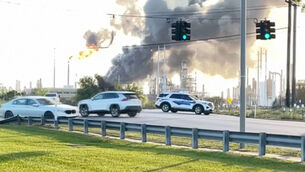 <p>Smoke rises near the Valero Port Arthur Refinery (KBMT via AP)</p>