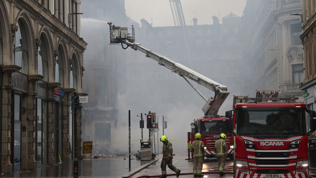 <p>Firefighters spent several days at the scene (Robert Perry/PA)</p>