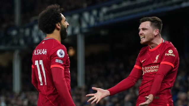 Andy Robertson (right) celebrates with Mohamed Salah (left) (Peter Byrne/PA)