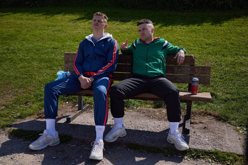 Jock O'Keeffe (Chris Walley), and Conor MacSweeney (Alex Murphy) sitting on the now iconic bench in Bell's Field. Picture: BBC/Vico Films