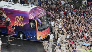<p>Fans cheer a bus carrying Royal Challengers Bengaluru after they won cricket's Indian Premier League in June. Guinness maker Diageo owned a 55% stake in the team which is set to sell for $1.8bn. Picture: AP Photo/Aijaz Rahi</p>