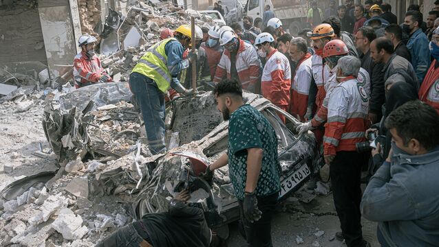 <p>First responders inspect a destroyed car at the site of a residential building hit in an overnight strike during the U.S.-Israeli military campaign in Tabriz, East Azerbaijan Province. Picture: AP Photo/Matin Hashemi.</p>