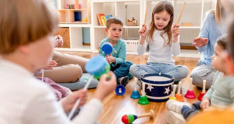 Preschool Children Playing Music Using Various Colorful  Instruments