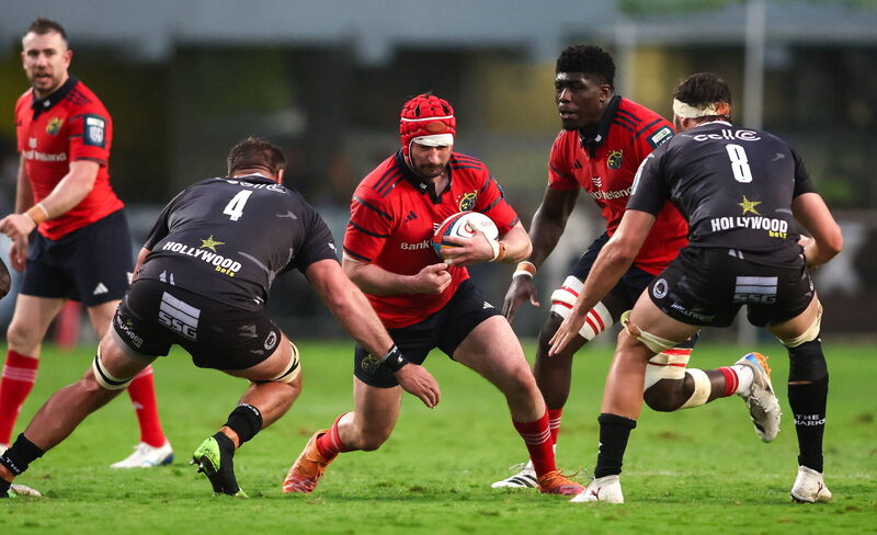 John Hodnett attempts to get past Jason Jenkins and Nick Hatton in Durban. Pic: Shaun Roy/Sportsfile