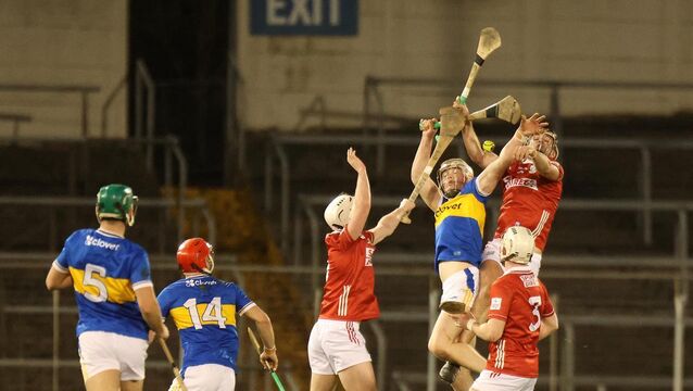 <p>THE CLIMB: Ben Walsh, Cork and Evan Morris, Tipperary, clashing for the sliotar in the MU20HC in Semple Stadium. Pic: Brendan Gleeson</p>