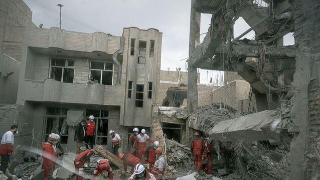 Rescue workers at a residential building hit in an overnight strike in Tabriz, Iran (Matin Hashemi/AP, File)